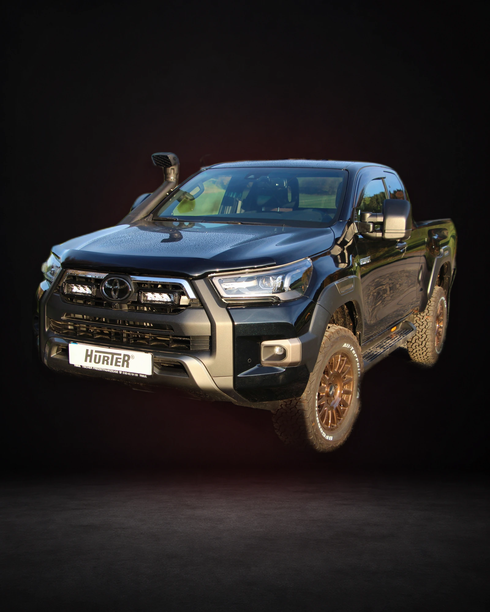 Hilux Invincible (Atira de fuzil na caçamba)